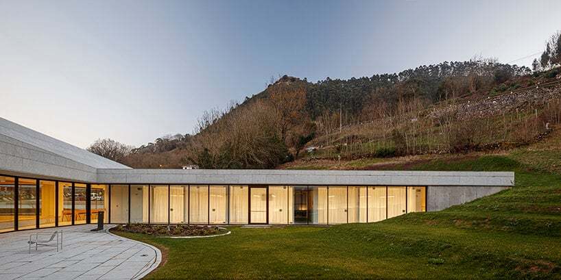 a folded stone roof crowns this visitor center in the spanish hillside