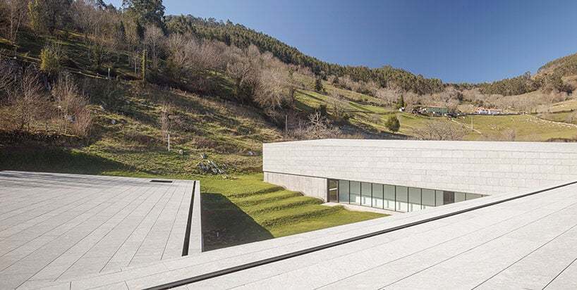 a folded stone roof crowns this visitor center in the spanish hillside